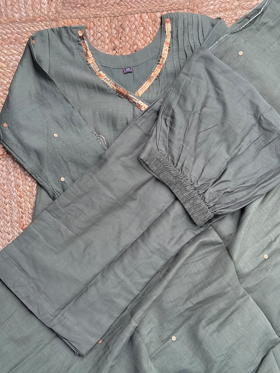 The Olive Green Tissue Silk Suit Set - Pleated V-Neck Flared Kurti, Straight Pants & Matching Dupatta